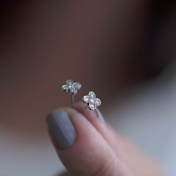 Clover Petite Fleur Diamond Earrings hand held pair