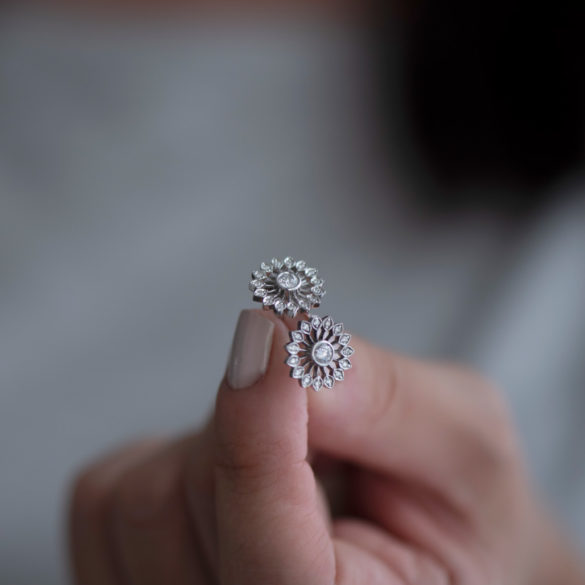 Dandelion Petite Fleur Diamond Earrings hand held pair