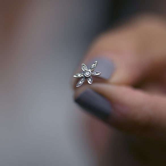 Wild Lily Petite Fleur Diamond Earrings hand held single