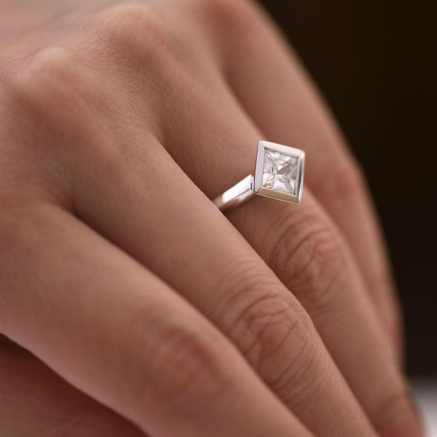 Bezel Set On Point Princess Diamond Engagement Ring Hand View