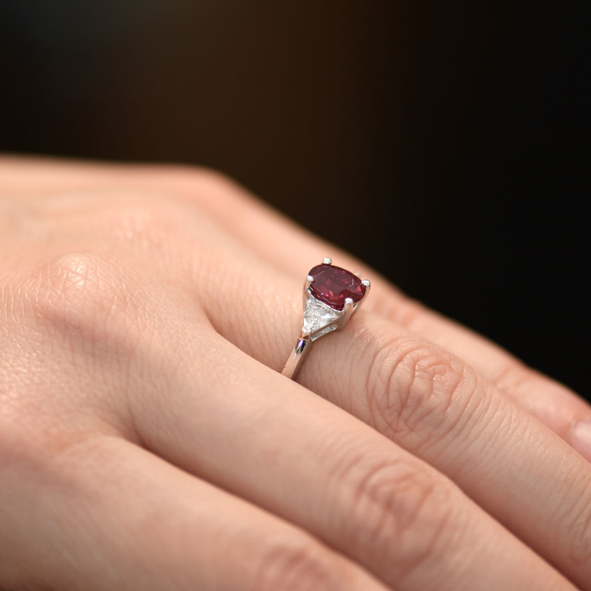 Ruby Oval and Diamond Trillion Ring Hand view