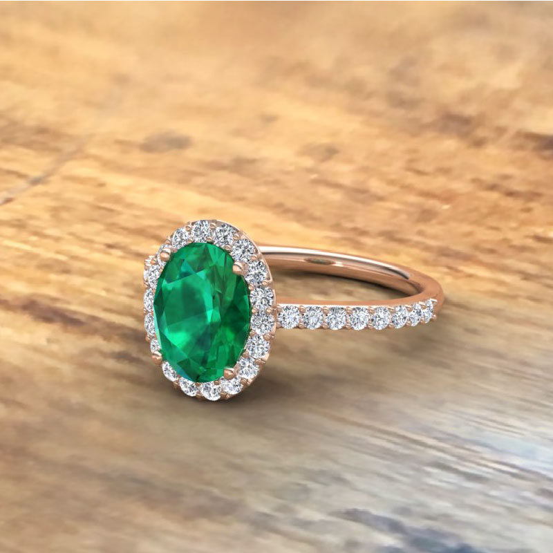 Rose Gold Oval Emerald ring with Diamond Halo