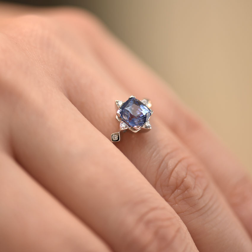 Blue Sapphire Ring With Diamond Accents In White Gold hand view
