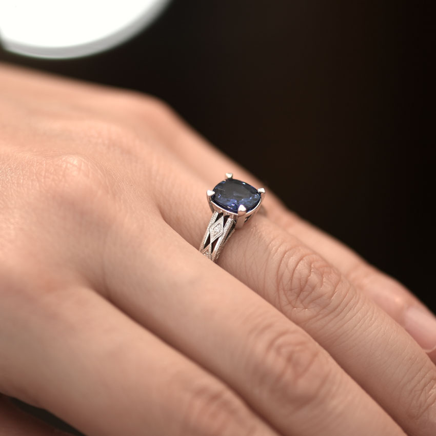 Violet Blue Sapphire With Diamond Accents In White Gold Ring Hand View