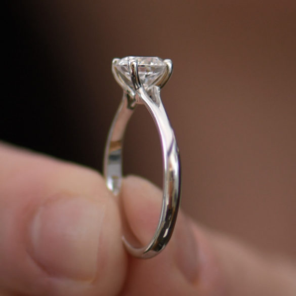 Round Cut Solitaire Diamond Engagement Ring With a 4 Prong Suspended "V" Setting
