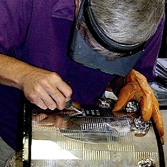 Here is Richard hand engraving the name of a recent winner on the Indy 500 Trophy as he did for over 35 years.