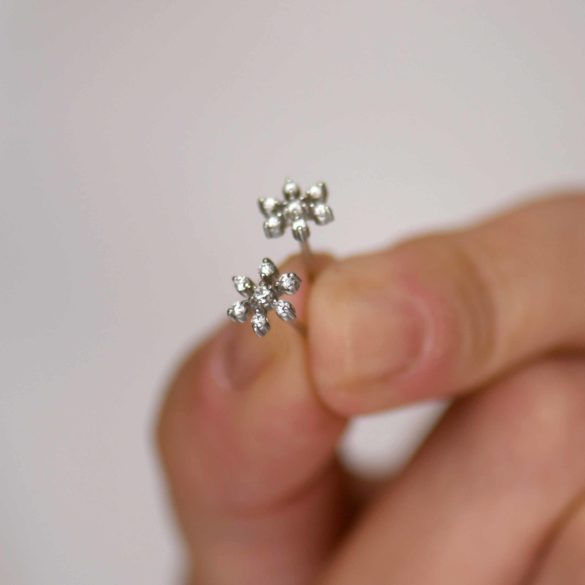 Diamond Snowflake Fireworks Earrings hand held