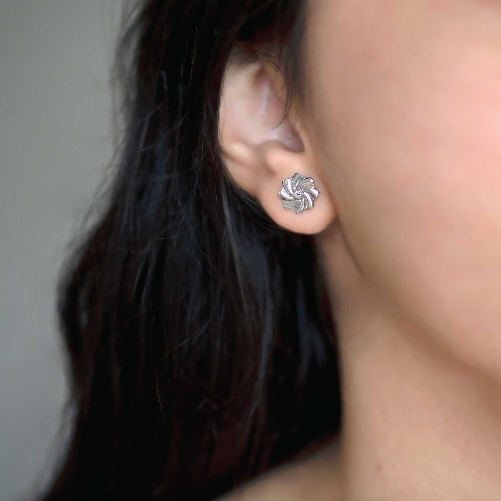 Facing East Japanese Pinwheel Diamond Stud Earrings, white gold, on ear