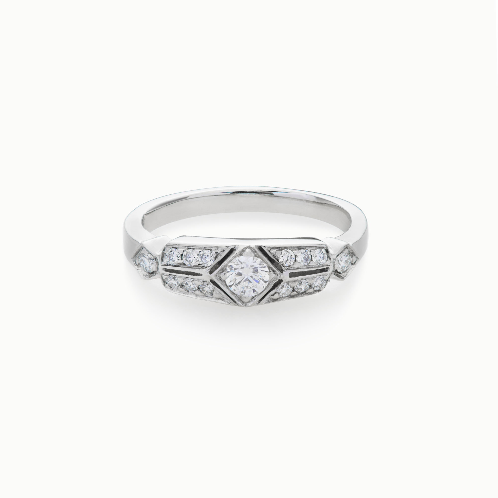 art deco diamond engagement ring with round diamond accents