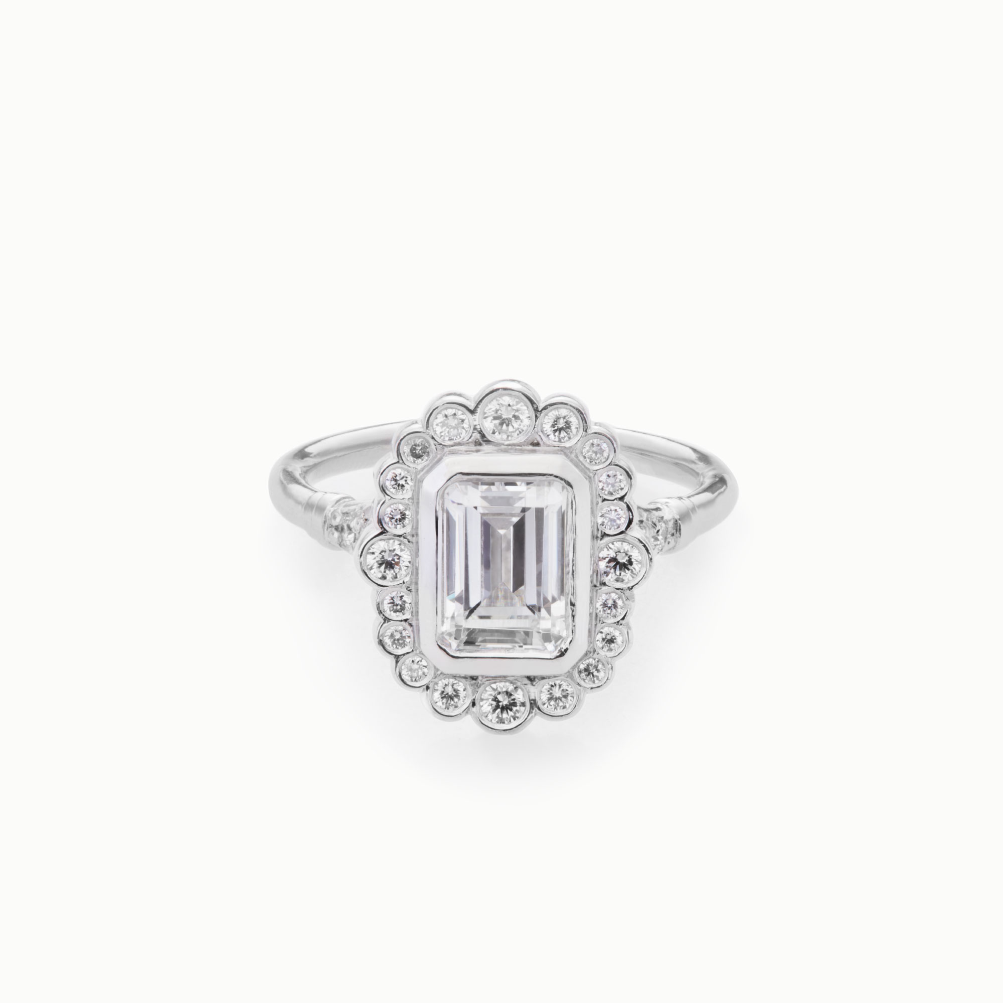 emerald cut diamond engagement ring with round diamond accents