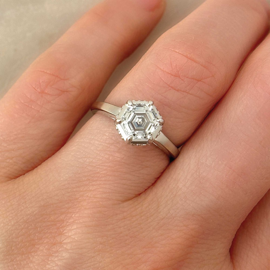 hexagonal lab grown diamond with 6 prongs and hidden halo on finger