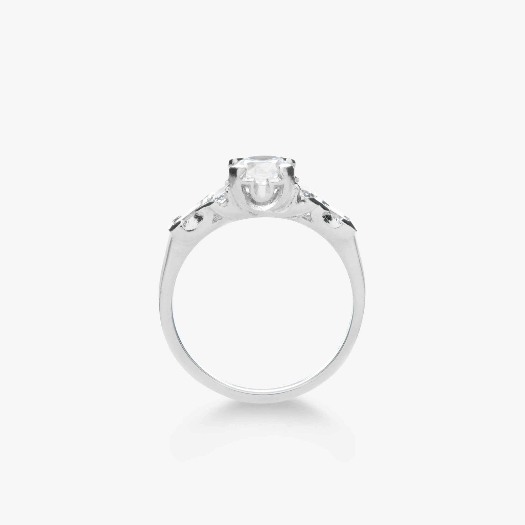 round brilliant diamond art deco style ring with oval and baguette diamond accents