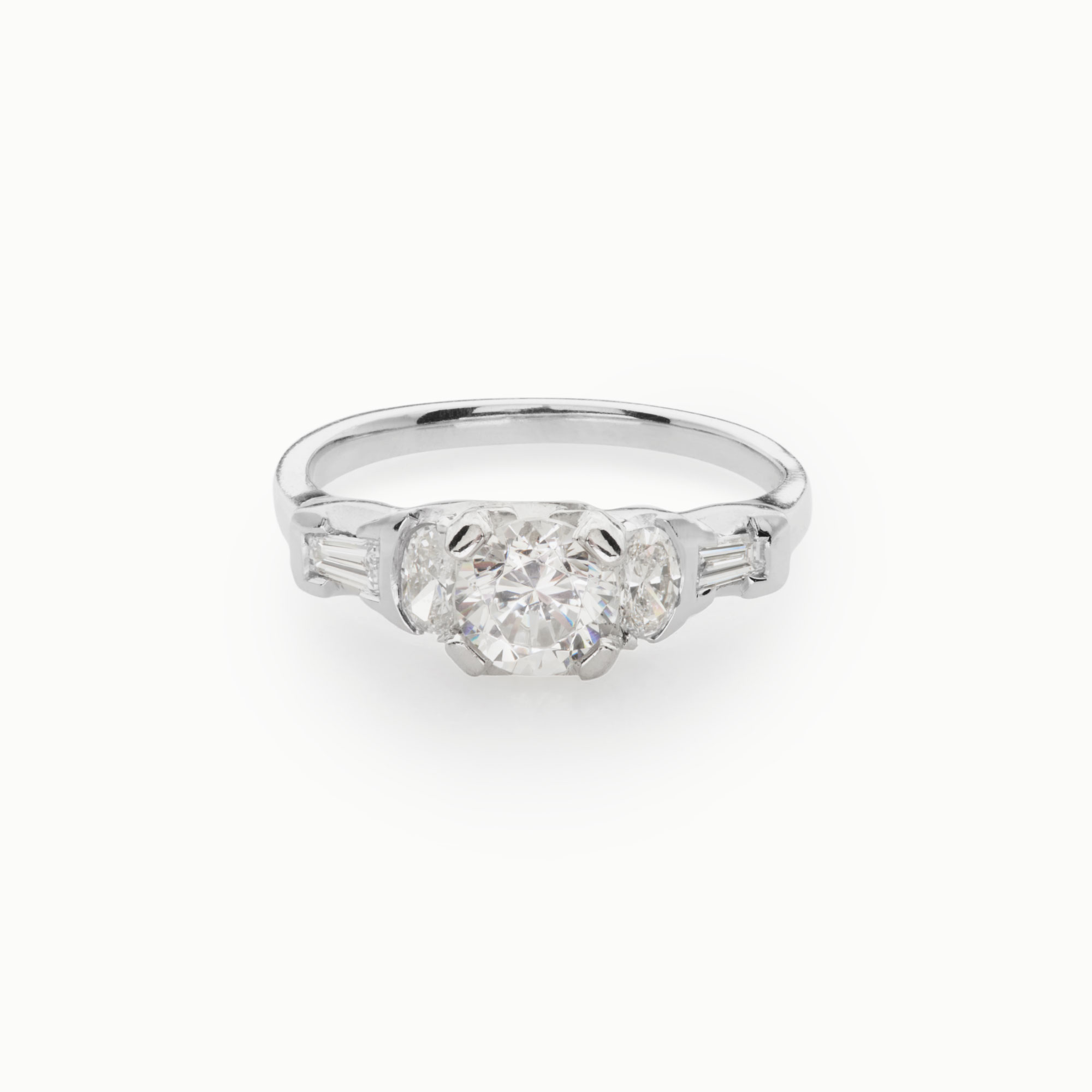 round brilliant diamond art deco style ring with oval and baguette diamond accents