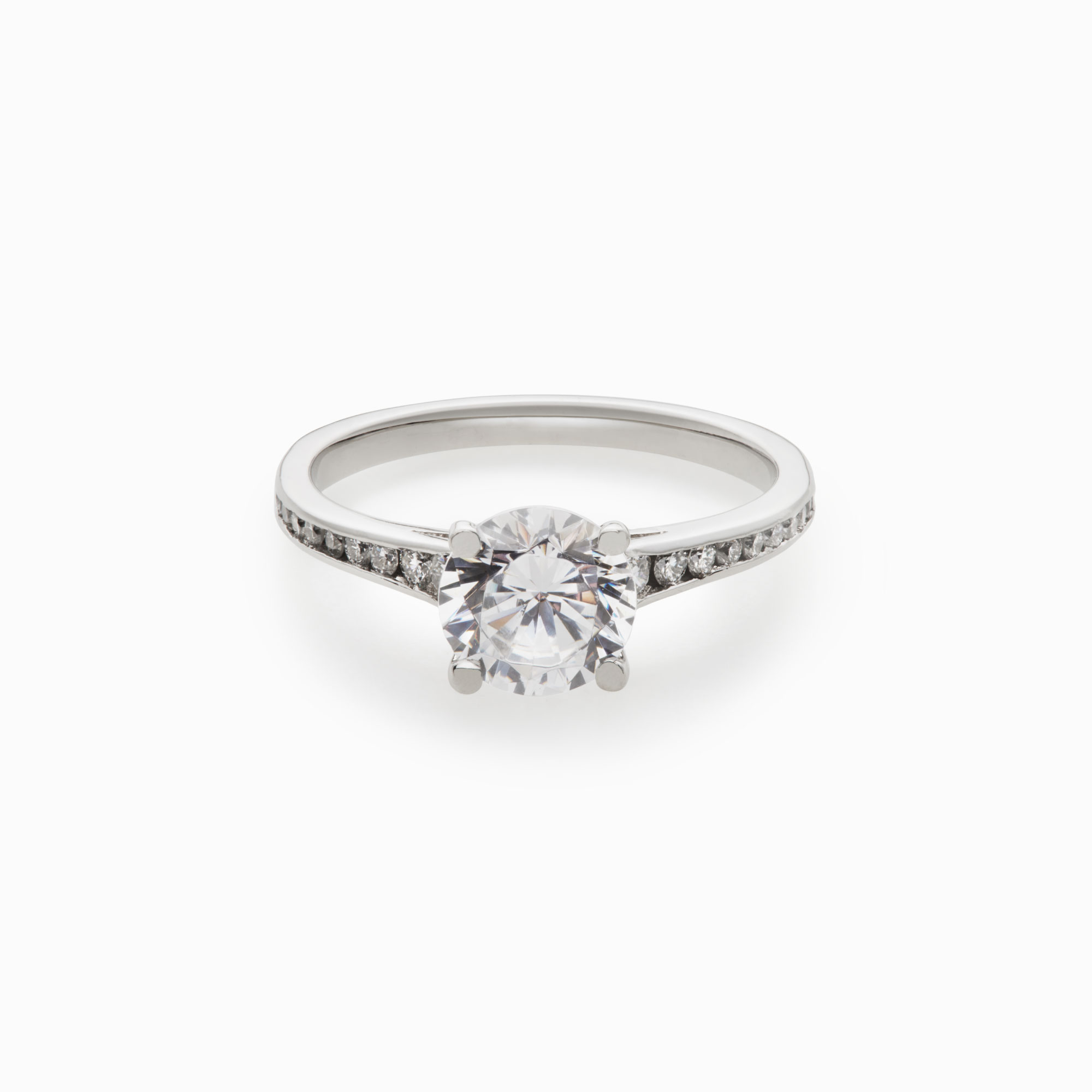 round brilliant diamond engagement ring with channel accents