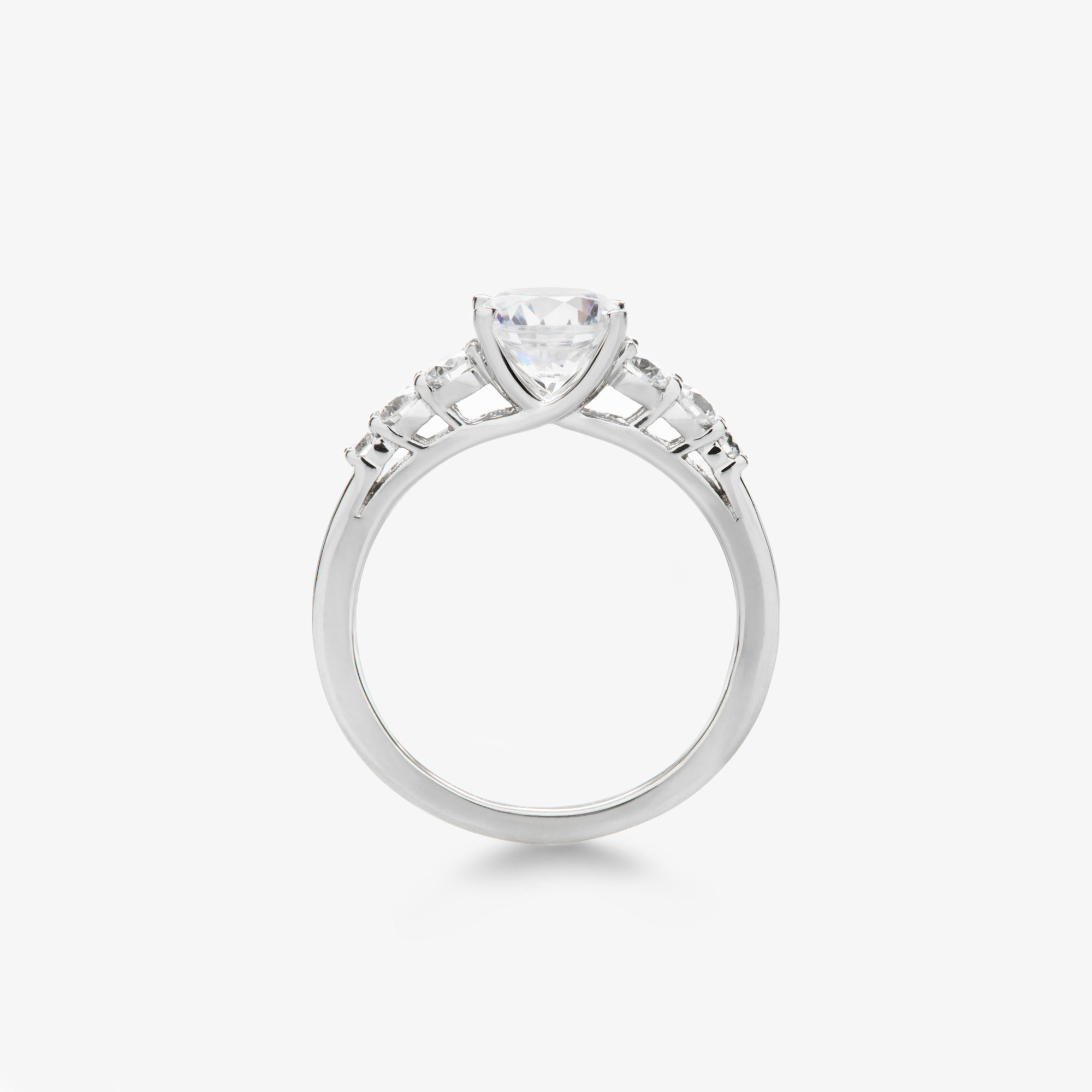 round brilliant diamond engagement ring with tapered round diamond accents