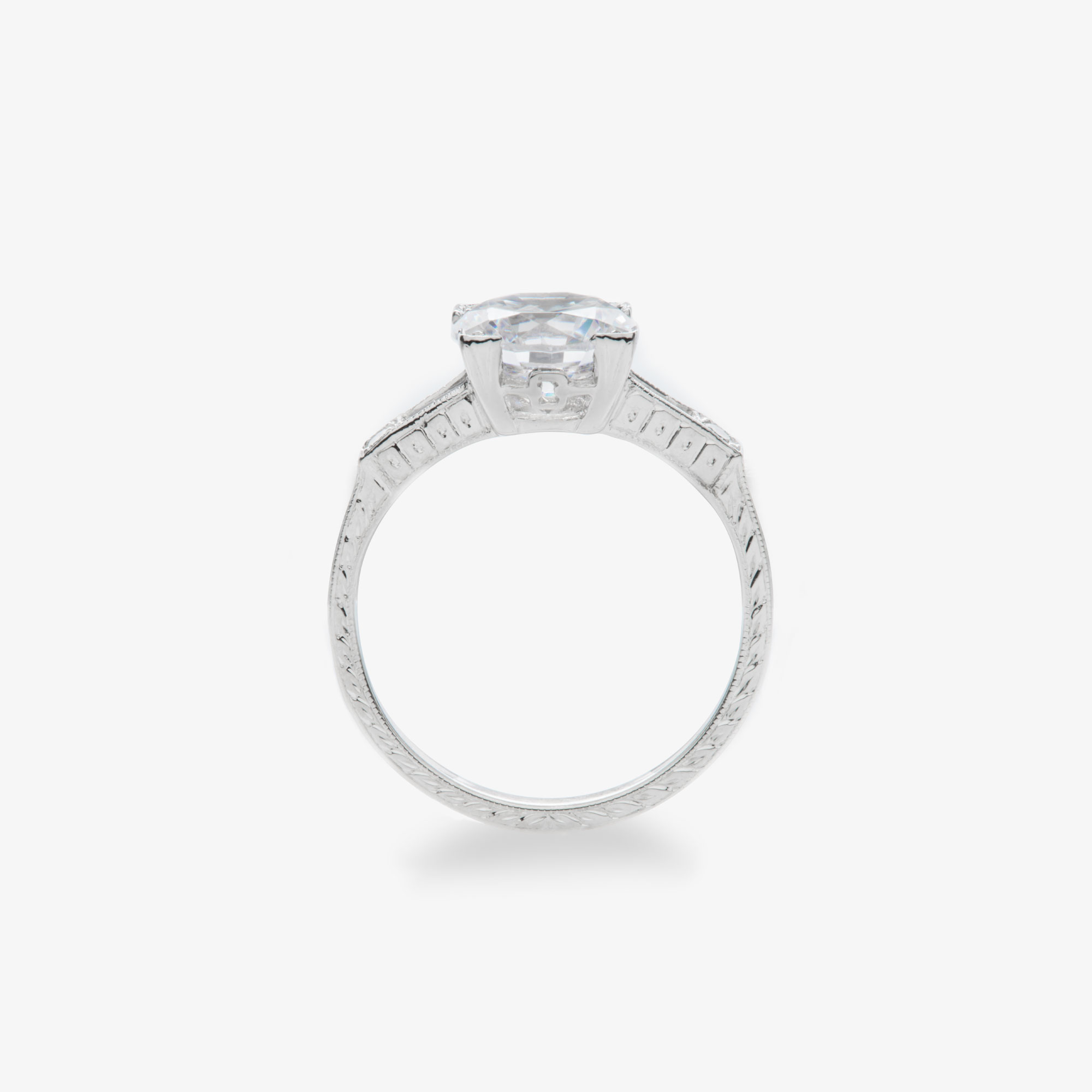 round brilliant diamond vintage style engagement ring with straight baguette and round diamond accents alt view