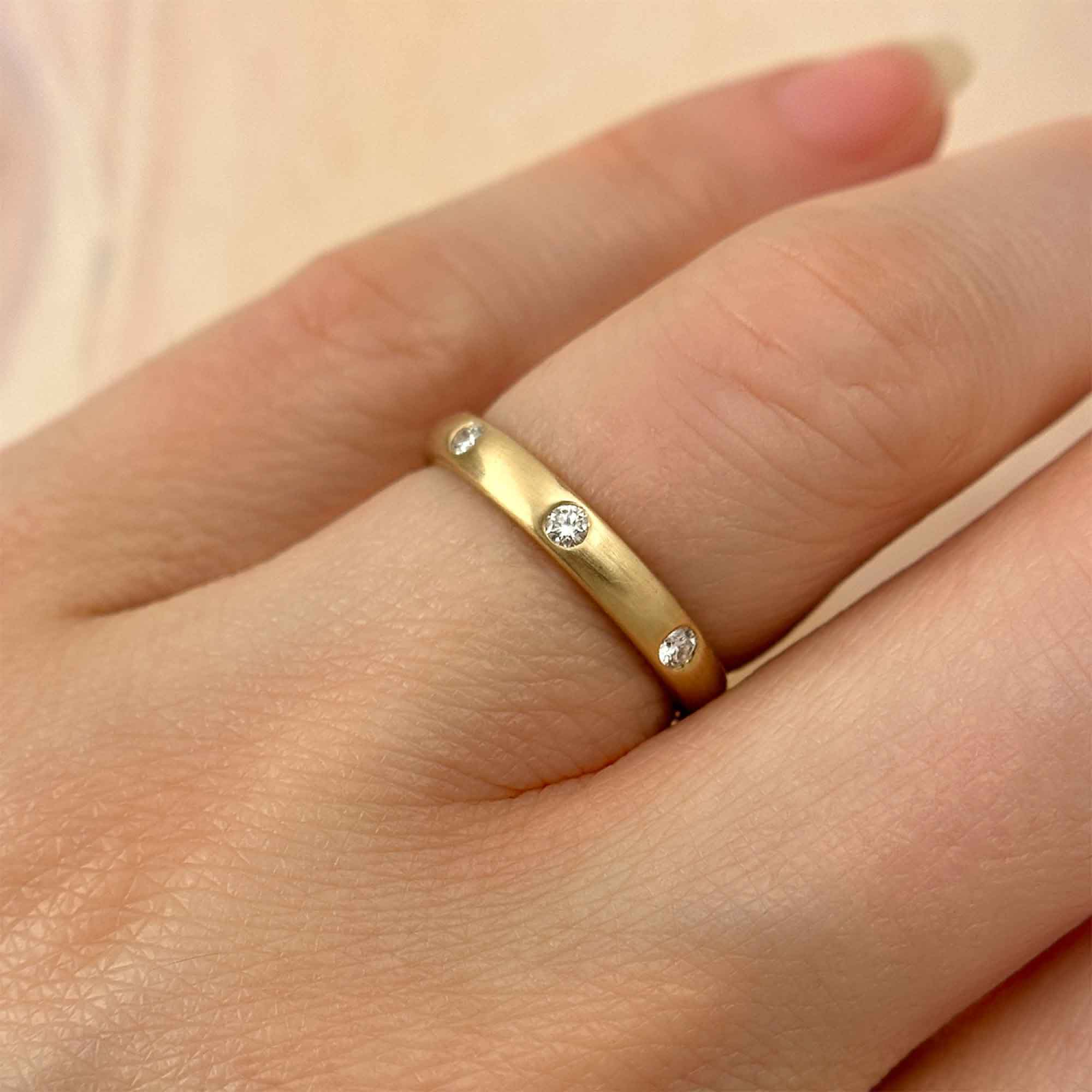 Flush-set Diamond Yellow Gold Band, on Ring Finger
