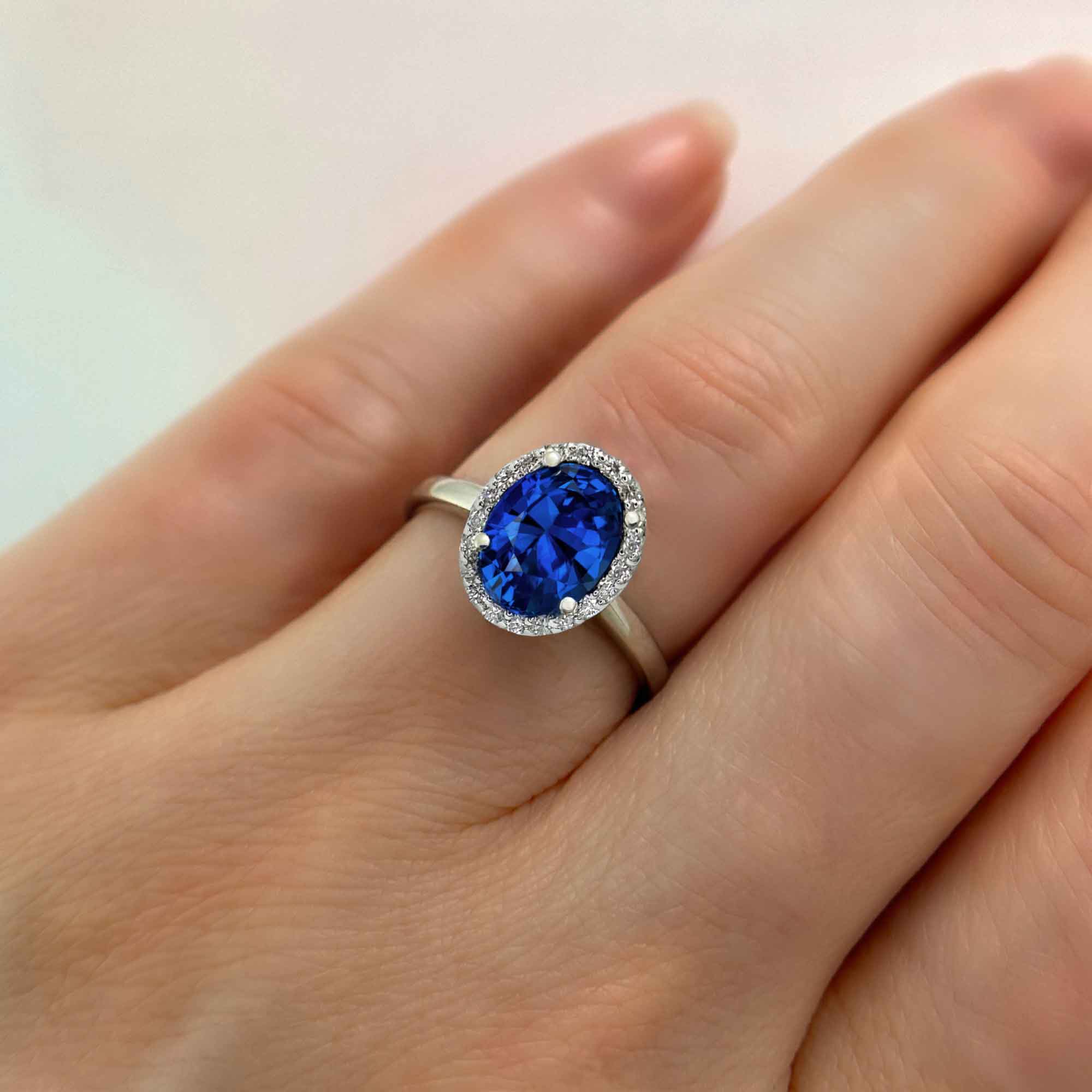 One Of A Kind Blue Sapphire Oval and Diamond Halo Ring, on Hand