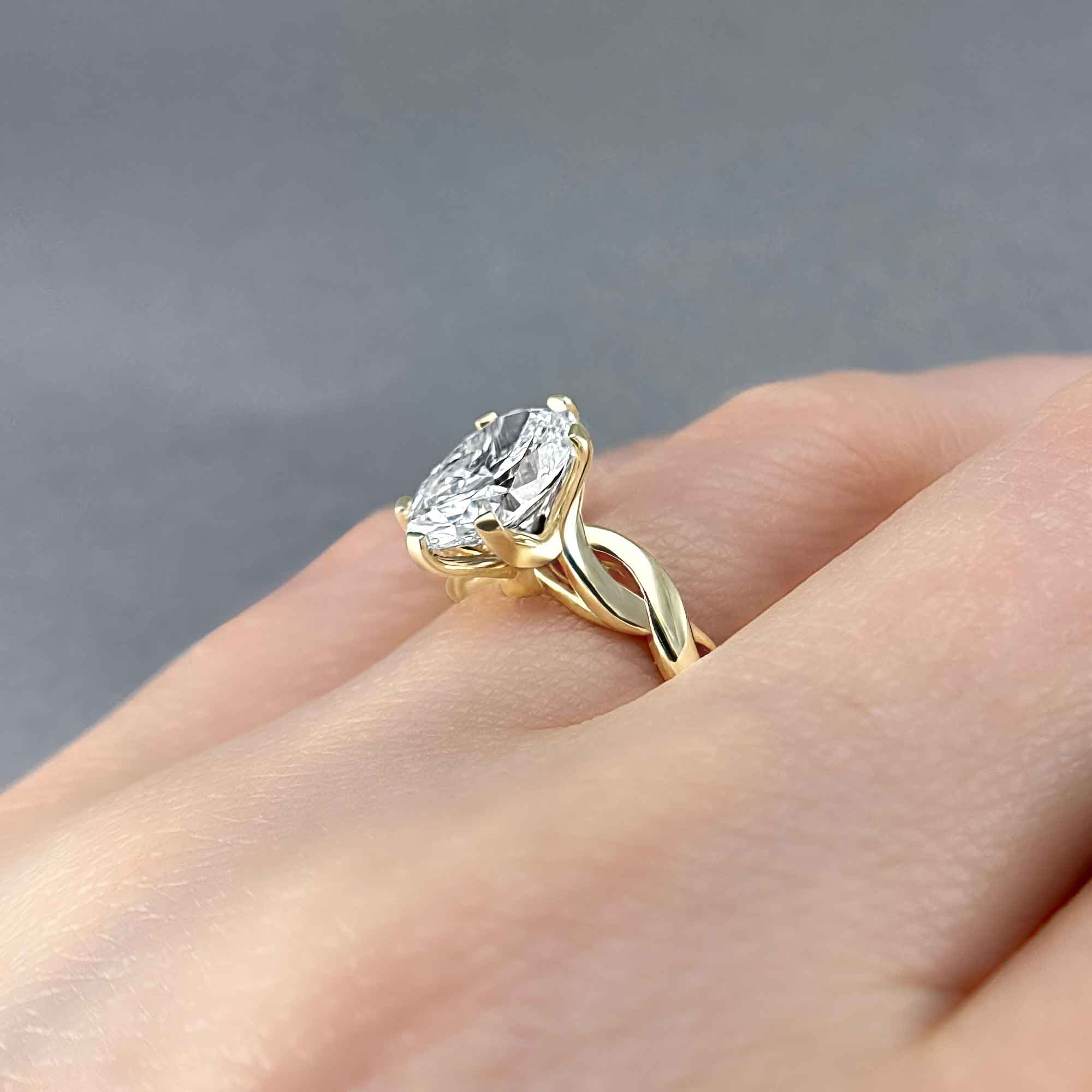 Oval Diamond Solitaire, Twisted Vine Engagement Ring, on Ring Finger, Alternative View