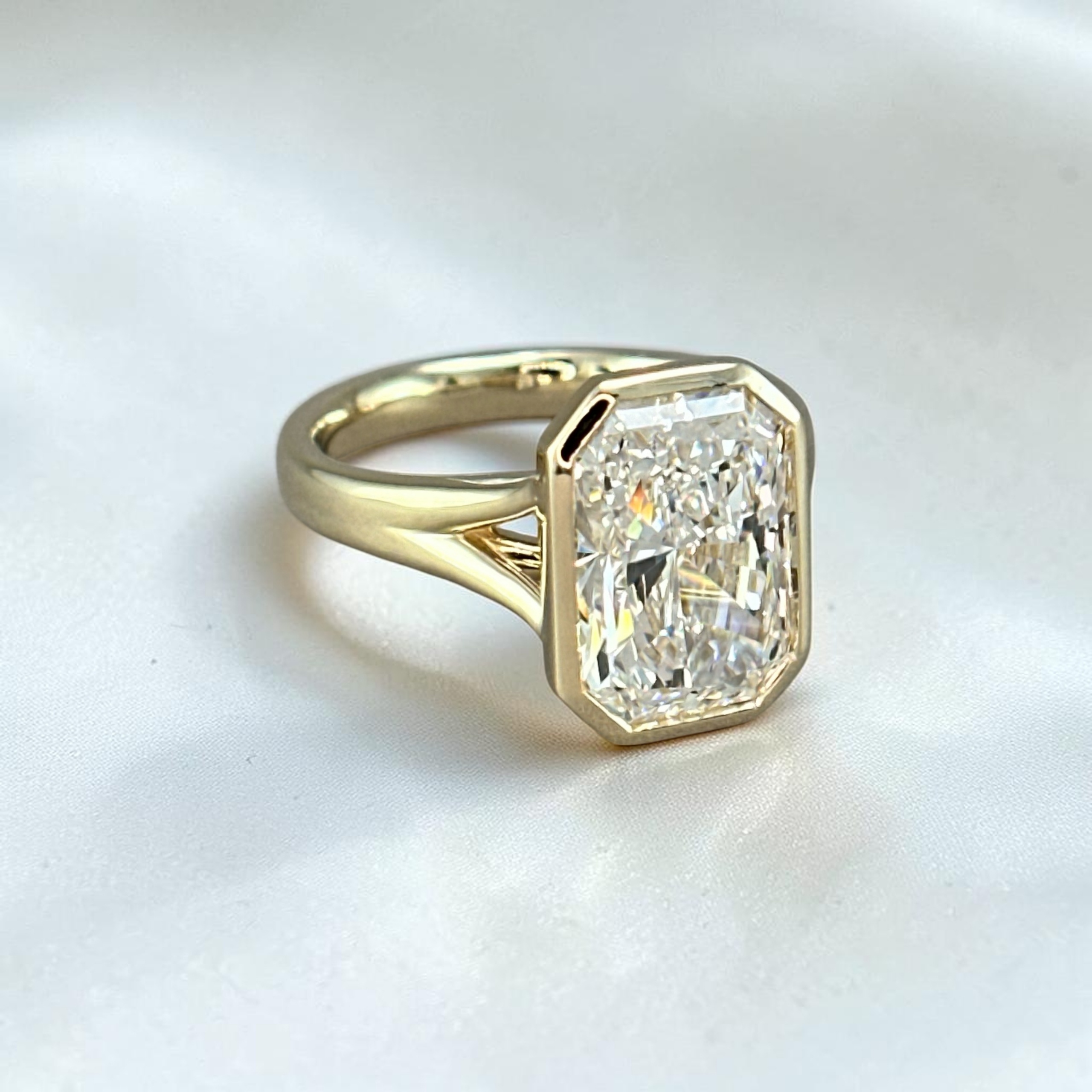Radiant-cut bezel split shank diamond ring, custom jewelry design